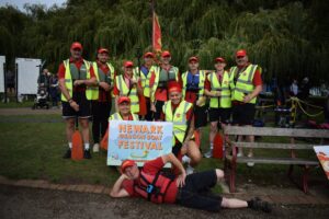 International Export Packers team taking part in the Newark Dragon Boat Festival on the River Trent, celebrating teamwork and community involvement.
