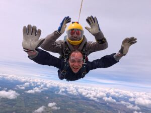 Serhii Titomyr captured mid-skydive during a charity jump for the Children’s Bereavement Centre, smiling as he freefalls through the sky.